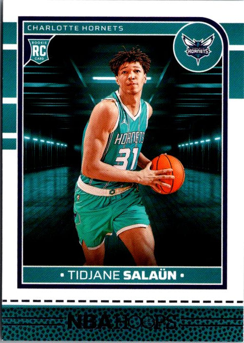 PANINI Tidjane Salaun rookie card featuring the player in a Charlotte Hornets uniform holding a basketball
